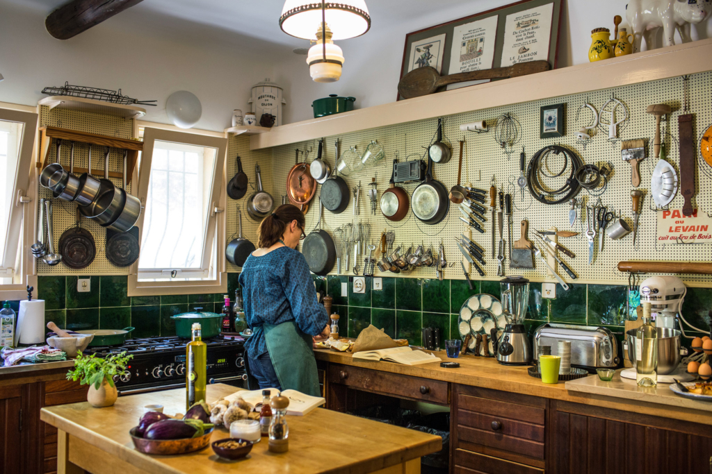 Julia Moskin cooking in Mrs. Child’s kitchen at the house, La Pitchoune. Credit France Keyser for The New York Times